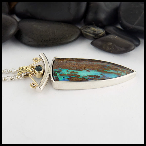 Profile view of custom Opal pendant in Sterling Silver and 18K Yellow Gold set with an accented oval tourmaline