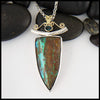 Custom Opal pendant in Sterling Silver and 18K Yellow Gold set with an accented oval tourmaline.