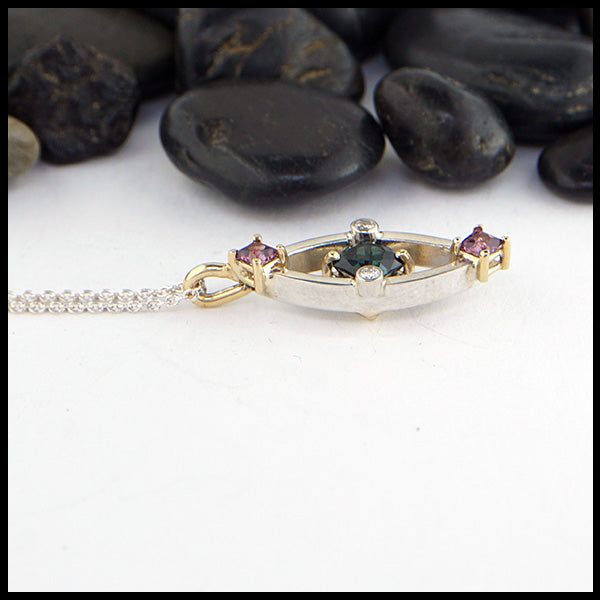 Custom pendant in silver and gold with Tourmaline, Rhodolite Garnets, and Diamonds
