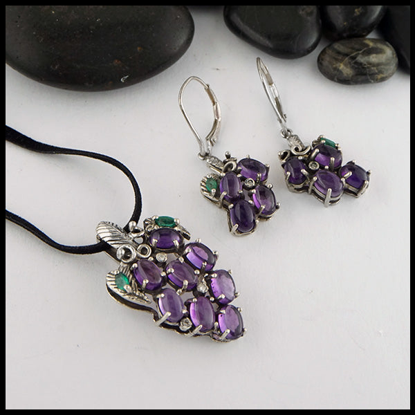 Grape Pendant and Earring set in Sterling Silver. Set with Amethyst cabochons, marquise Emeralds, and Diamond Accents.