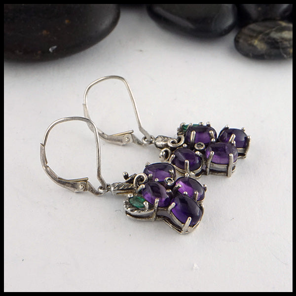 Grape Earrings set in Sterling Silver. Set with Amethyst cabochons, marquise Emeralds, and Diamond Accents.