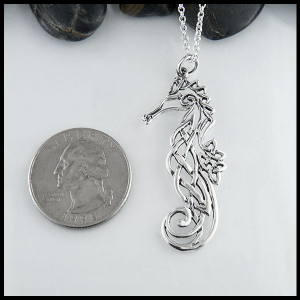 Celtic Seahorse Pendant compared to a quarter