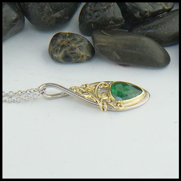 Profile view of Custom Ivy pendant in 14K White gold and 18K yellow gold with Tsavorite