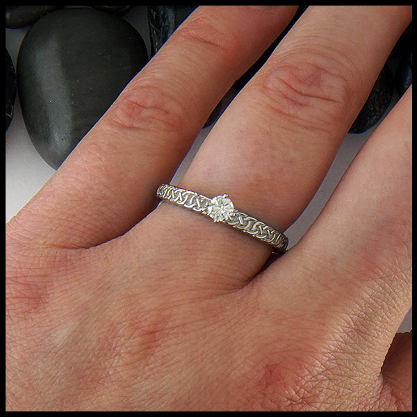 Josephine's Knot band in 14K White gold with reclaimed diamond on model's hand