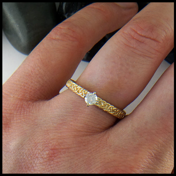 Josephine's Knot ring in 14K Yellow Gold with Reclaimed Diamond shown on model's hand