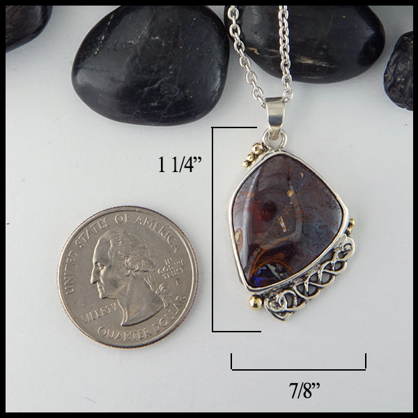 Pendant measures 1 1/4" by 7/8"