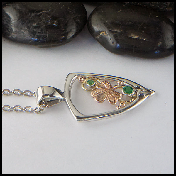 Shamrock pendant in silver and gold with Tsavorite