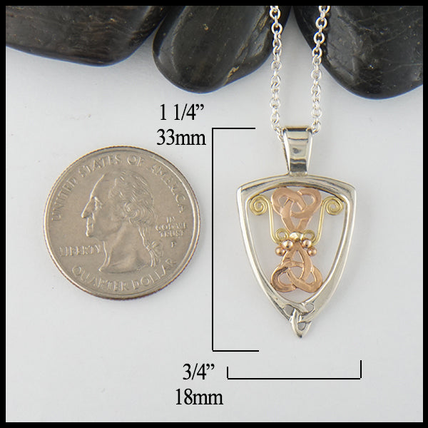 Pendant measures 1 1/4" by 3/4"