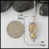 Pendant measures 1 3/8" by 5/8"