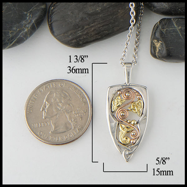 Pendant measures 1 3/8" by 5/8"