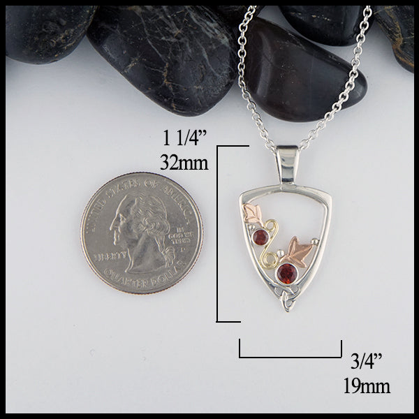 Garnet Ivy Pendant in silver and gold measures 1 1/4" by 3/4"