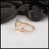 Profile view of Custom Heart ring in 14K Rose, White, and Yellow gold with Tsavorite and Diamonds