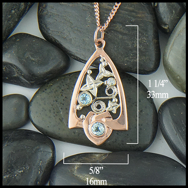 Blue Topaz  Pendant in 14K Rose and White Gold measures 5/8" by 1 1/4"