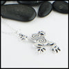 Profile view of Celtic frog pendant in sterling silver.