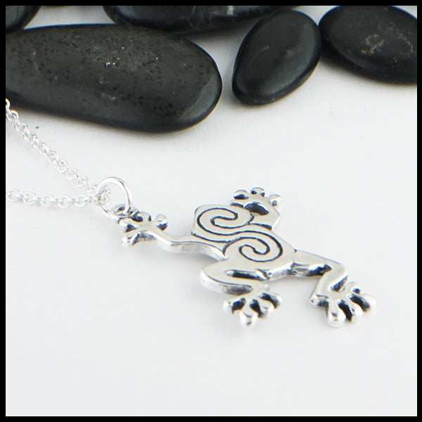Profile view of Celtic frog pendant in sterling silver.