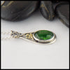 Profile view of Chrome Diopside Pendant with 18K Yellow Shamrock