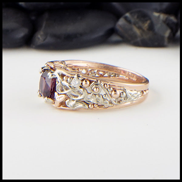 Profile view of purple garnet ring