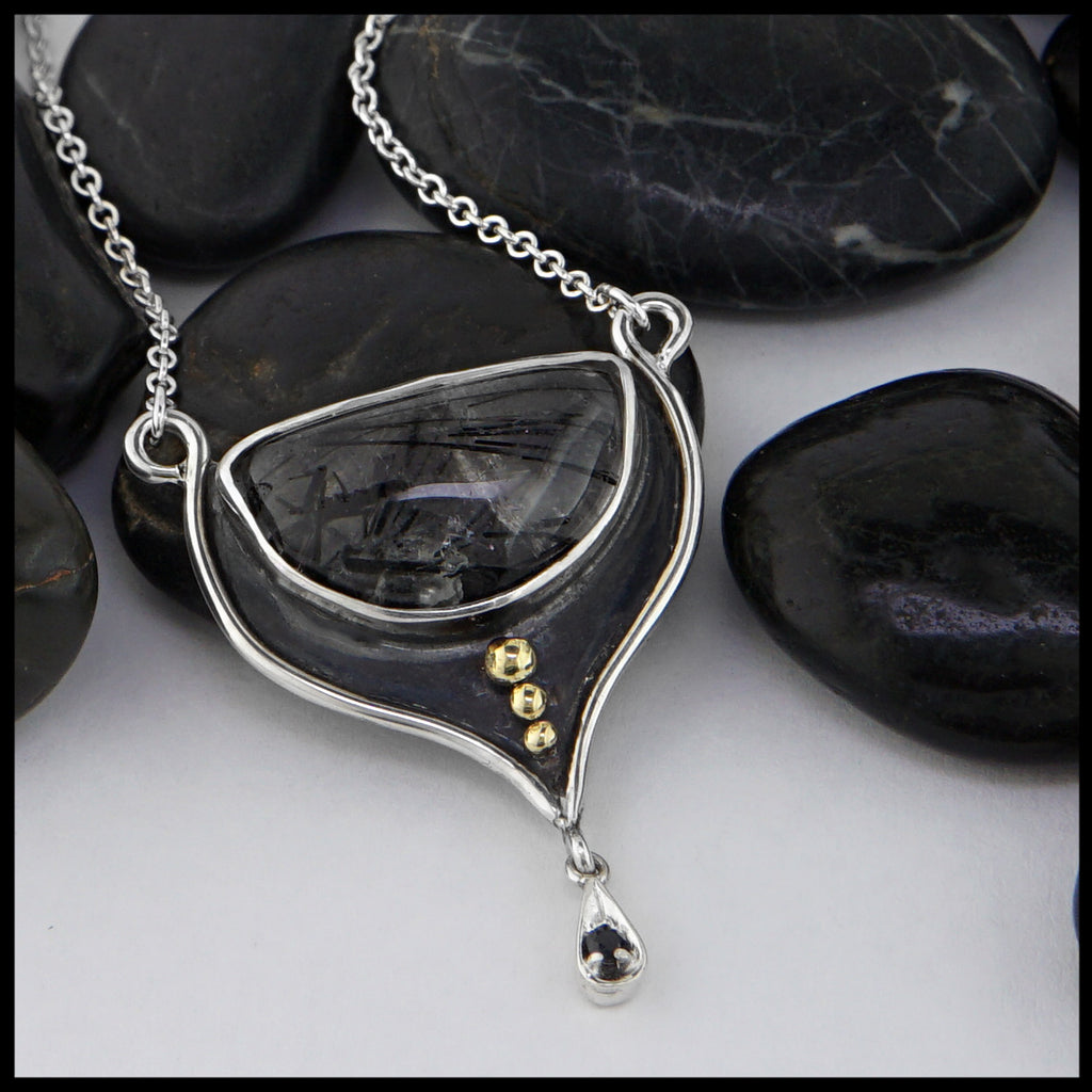 rutilated quartz pendant with black sapphire 