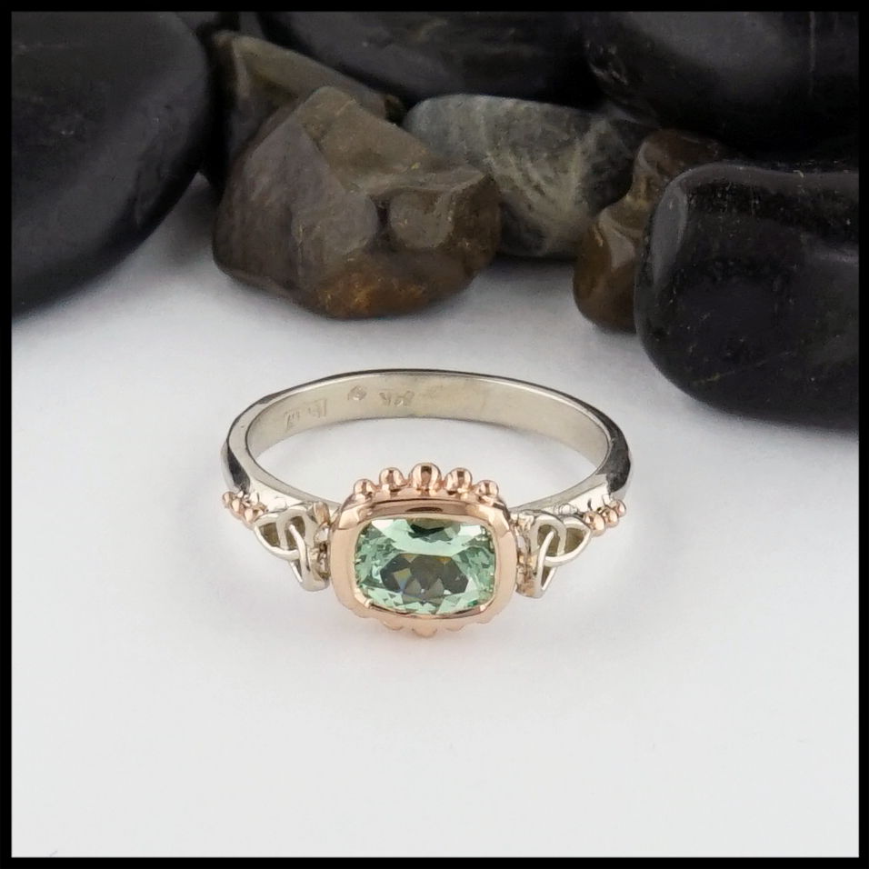 This Mint Garnet is set in a 14K Yellow and Rose Gold frame