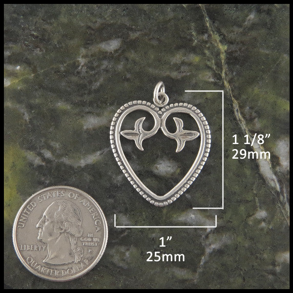 Ornate Celtic heart pendant in Sterling Silver measures 1 1/8" by 1"
