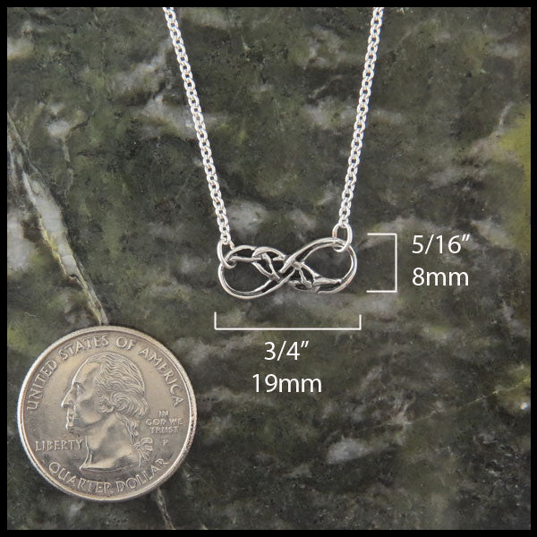 Infinity Knot pendant in sterling silver measures 5/16" by 3/4"