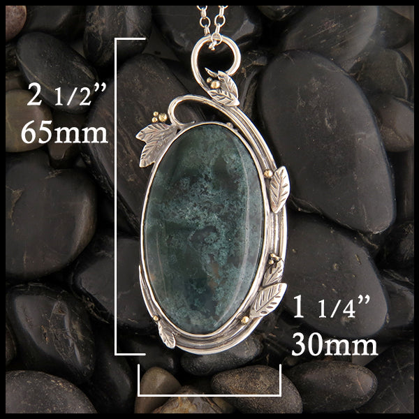 dimensions of the forest green moss agate pendant are 2.5 inches or 65 millimeters long by 1.25 inches or 30 millimeters wide