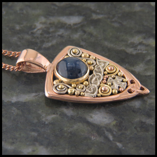 Gold Celtic pendant with Sapphire