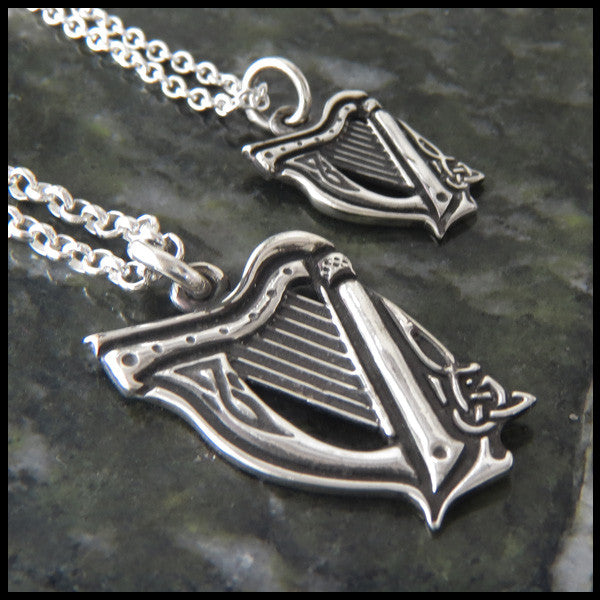 Profile view of large and small celtic harp pendants