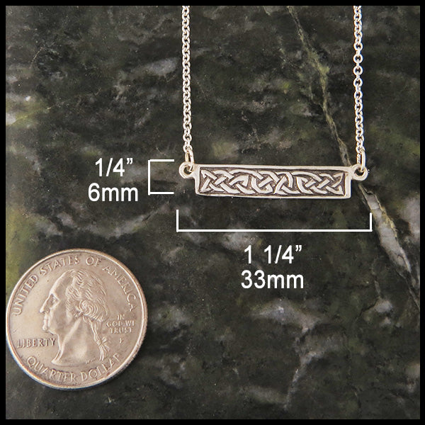Simple bar pendant measures 1/4" by 1 1/4"