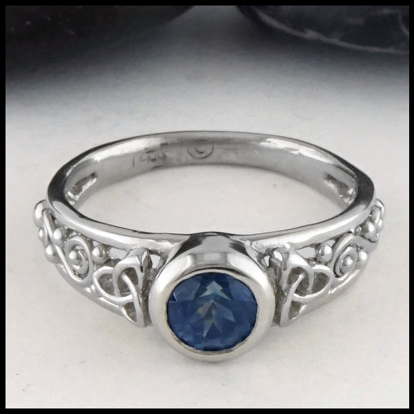 Front view of Montana Sapphire and Trinity Knot Gold Ring
