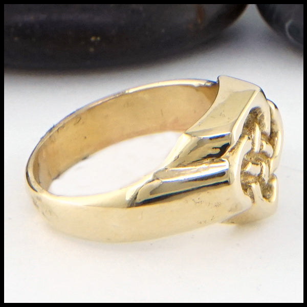 Profile view of Father's Knot ring in gold