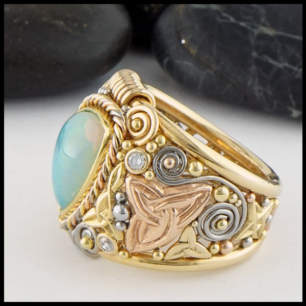 Profile view of Ethiopian Opal Ring in yellow, rose, and white gold