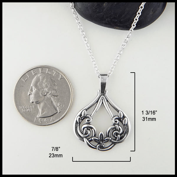 Pendant measures 7/8" by 1 3/16"
