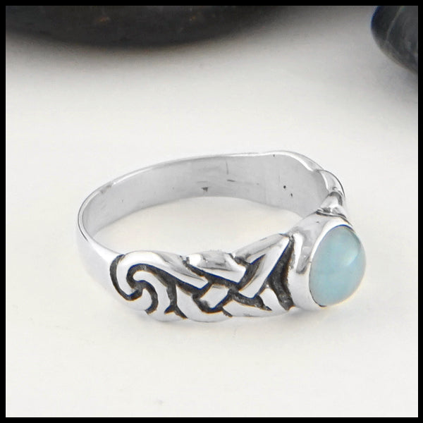 Profile view of Ban Tigherna Celtic Ring with Aquamarine
