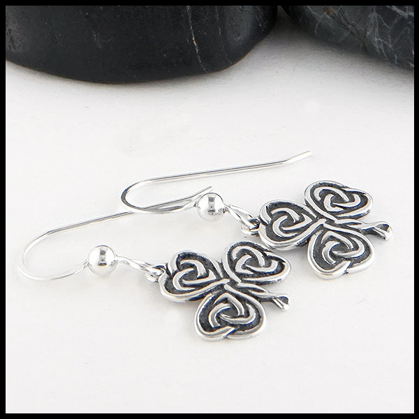 Profile view of Heart Shaped Shamrock Drop Earrings