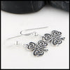 Profile view of Heart Shaped Shamrock Drop Earrings