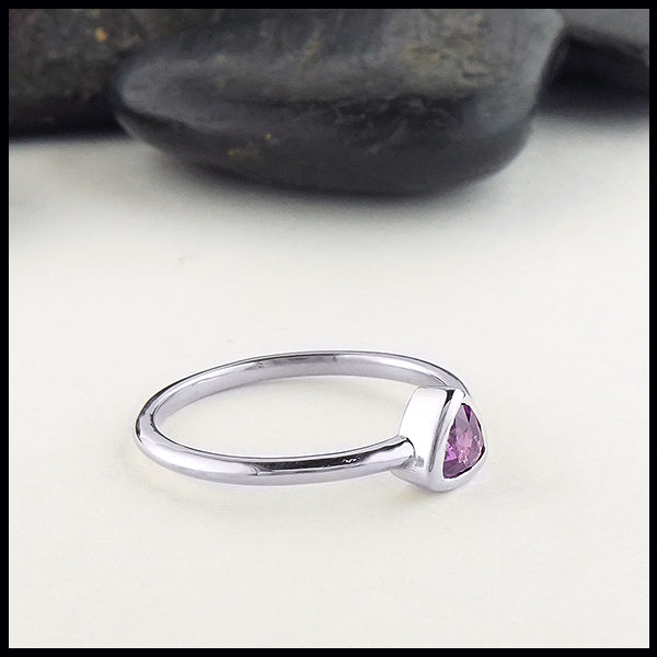 Profile view of trillion purple sapphire ring