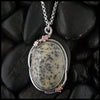 Dendritic opal pendant in silver and rose gold
