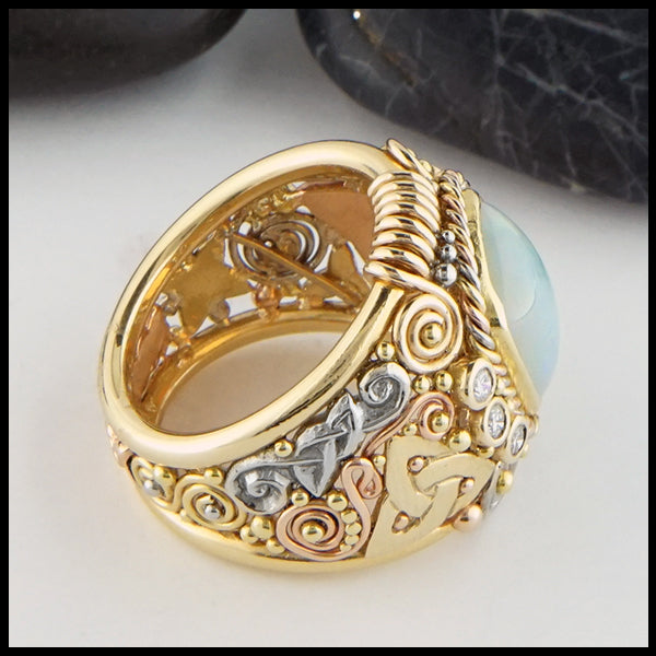 Profile view of Ethiopian Opal Ring in yellow, rose, and white gold