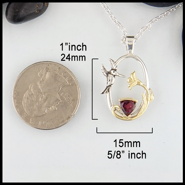Sterling silver hummingbird pendant with raspberry tourmaline and yellow gold accents measurments 1"inch by 5/8"inch