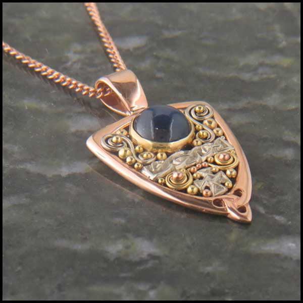 Gold Celtic pendant with Sapphire