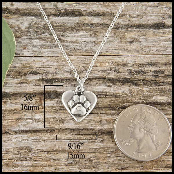 Personalized paw print pendant measures 5/8" by 9/16"