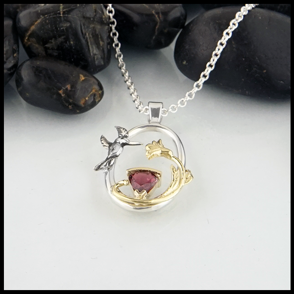 Sterling silver hummingbird pendant with raspberry  tourmaline and yellow gold accents