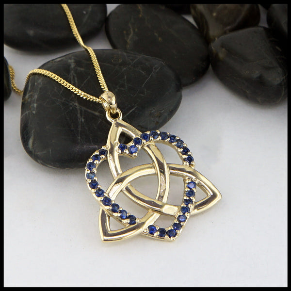 trinity knot heart pendant with sapphire
